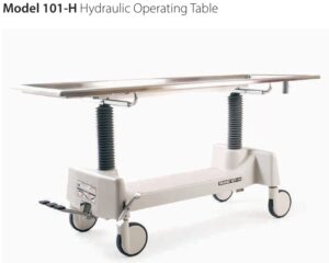 Hydraulic operating table on a wheeled stand with adjustable legs and metal top, Model 101-H.
