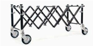 Folding mobile scaffold frame with four caster wheels, extended for a portable elevated work surface.