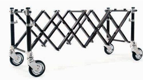 Folding mobile scaffold frame with four caster wheels, extended for a portable elevated work surface.